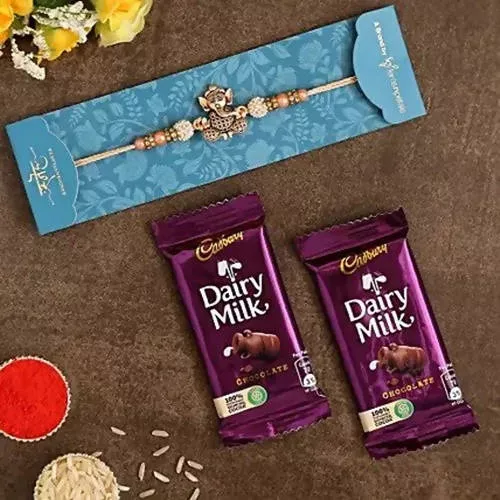 Enticing Ganesha Rakhi & Dairy Milk Chocolate - Combo Pack